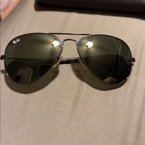 RAYBANS Black aviator sunglasses.